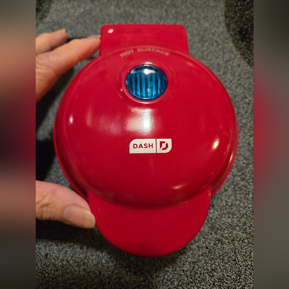 Cute mini red electric waffle maker. Used twice. Great condition.